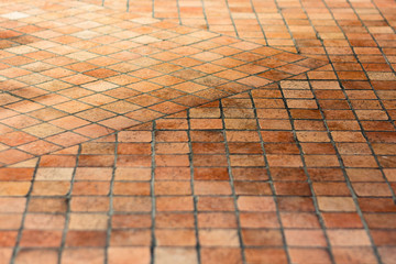 A simple mosaic of the little retro tiles. A flat surface made of tiles the color of baked clay....