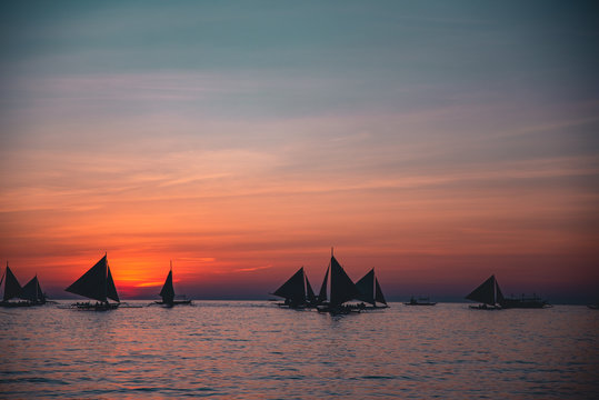 Paraw sailing at Boracay Island, Philippines at Sunset