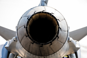 Rear part of jet engine exhaust of military fighter.