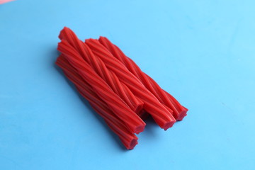 sweet red gummy licorice in color background