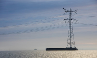 Fototapeta na wymiar electricity mast in Ketelmeer Netherlands. Energy. Power. Noordoostpolder