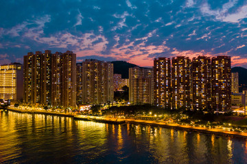 Fototapeta na wymiar Cityscape at night: sea and promenade, light in the windows of skyscrapers