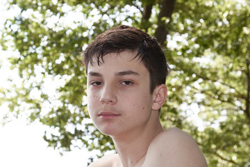 Portrait happy teenager on the nature background © justoomm