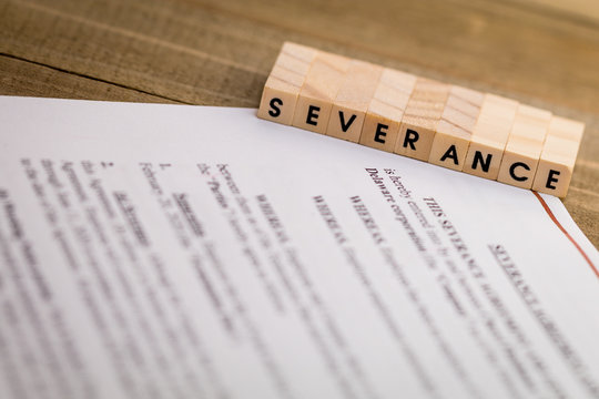 Severance Pay Concept With Agreement Document On Wooden Board