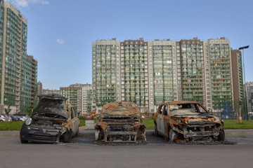 city burned cars after a fire in one of the city's districts