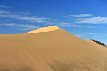 Sand dune and blue sky.