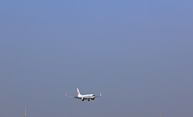 Large passenger aircraft flying at low altitude
