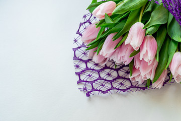 Bouquet of pink tulips for the holidays. Women's Day, Valentine's Day, name day. On white background.