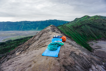 Passing the night in a sleeping bag on the ridge of the active volcano Bromo