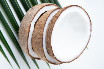 coconuts and Coconut oil  in a bottle  for cooking   nutrition  vegan ingredient  natural put on a white table,