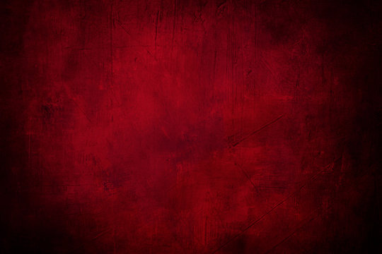 red grunge background or texture with dark vignette borders and spotlight