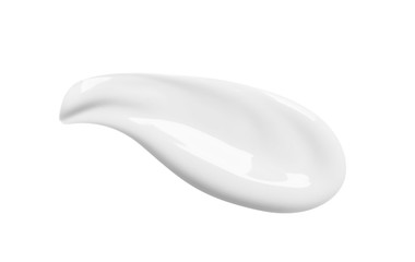 White cosmetic face cream lotion texture. Beauty creme swatch smudge smear isolated on white background. Moisturizer swipe. BB cream sample close-up