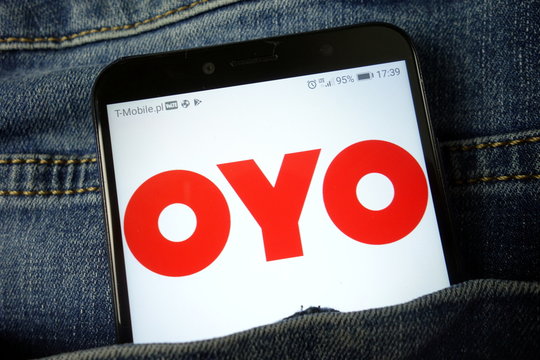 KONSKIE, POLAND - November 24, 2019: Oyo hotel chain logo on mobile phone