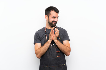 Barber man in an apron scheming something