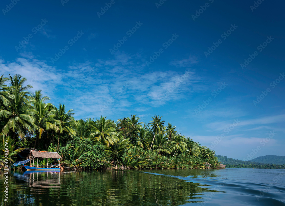 Wall mural boat and jungle hut on the tatai river in cambodia