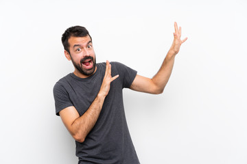Young handsome man over isolated white background nervous and scared