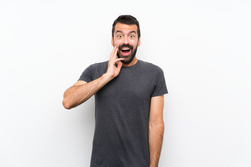 Young handsome man over isolated white background with surprise and shocked facial expression