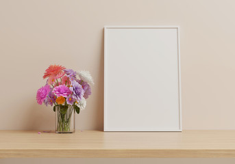 Flowers are put in a vase and white picture frame placed on wood table. 3D render.