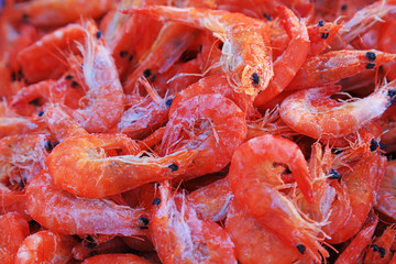 Piles of frozen prawns