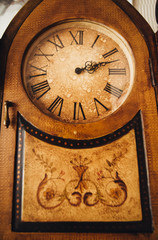Fototapeta na wymiar Antique, expensive, wall, brown wooden clock with Roman numerals. Photography, concept.