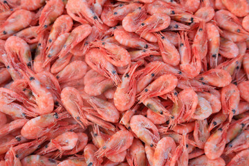 Piles of frozen prawns