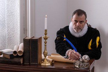 Recreation of a writer of the Spanish Golden Age (1492 to 1659), writing at his desk