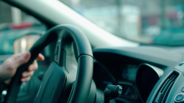 steering wheel closeup in mooving car, 4k footage