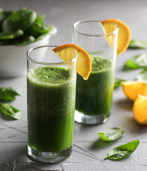 The concept of healthy kitchen. Smoothies of greens, spinach on a light background. Background image, copy space