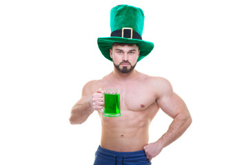 St. Patrick's day. A muscular man in a green hat holds a mug of ale and beer. Isolated white...