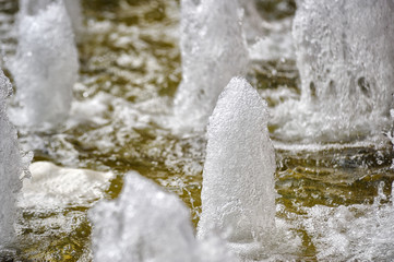 Close-up at splashing fountain water.