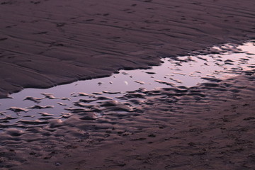 reflection in the beach
