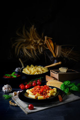 Rigatoni pasta with Bolognese sauce and fresh basil