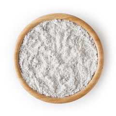 Rye flour in wooden bowl isolated on white background with clipping path