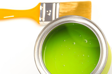 Can with green paint with brush  isolated on white background