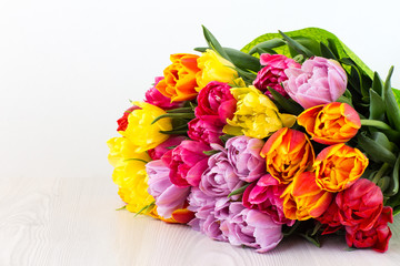 on a white background a bouquet of tulips and free space for text