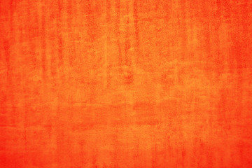 The texture of the orange surface. Orange paper background. Festive orange paper
