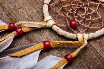 Close up from native americans  dream catcher on rustic wood