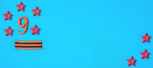 Banner. 9 MAY. St. George's ribbon. Festive blue background. Children's crafts made of plasticine for the veteran. 75 YEARS of Great Victory.