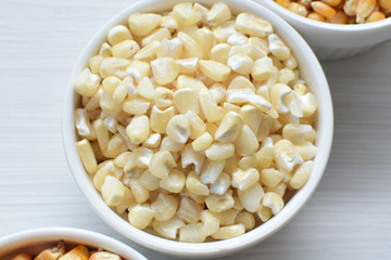grains of natural corn in containers