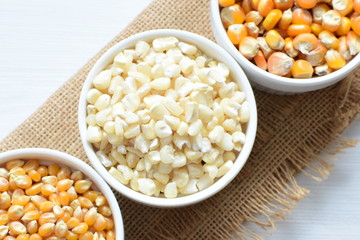 grains of natural corn in containers