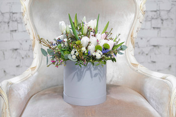 bouquet of colorful flowers on the couch