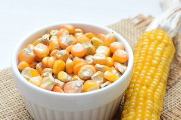 grains of natural corn in containers