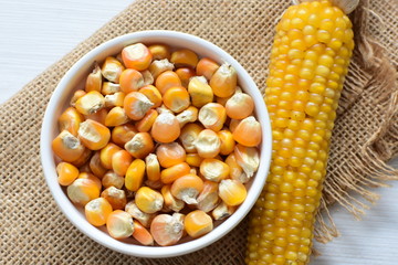 grains of natural corn in containers