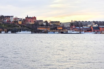 Fototapeta premium Stockholm, Sweden- January 2020. View from the water to the old city of Stockholm. Beautiful cityscape of the old city. The capital of Sweden. landmarks of Stockholm city. Scandinavia. North Europe 
