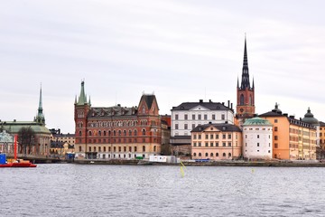 Fototapeta na wymiar Stockholm, Sweden- January 2020. View from the water to the old city of Stockholm. Beautiful cityscape of the old city. The capital of Sweden. landmarks of Stockholm city. Scandinavia. North Europe 