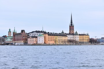 Naklejka premium Stockholm, Sweden- January 2020. View from the water to the old city of Stockholm. Beautiful cityscape of the old city. The capital of Sweden. landmarks of Stockholm city. Scandinavia. North Europe 
