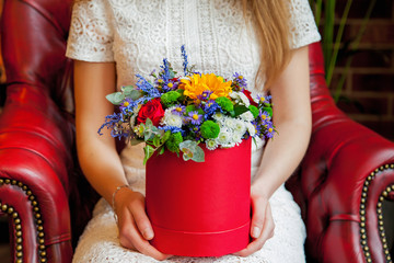 girl hold spring flowers in her hands