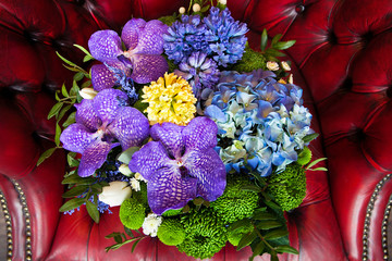 bouquet of colorful flowers on the couch