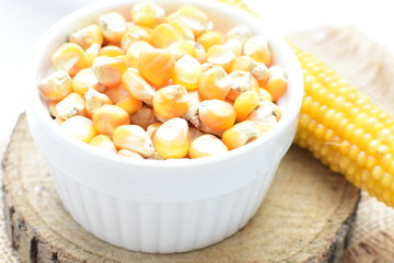 grains of natural corn in containers