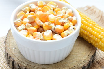 grains of natural corn in containers